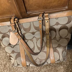 Coach shoulder handbag good used condition with brown leather trim!